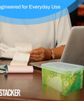 Person using a laptop with Durable 3x5 Index Card Box Organizer For Notes, Recipes, And Pics In Assorted Colors on desk
