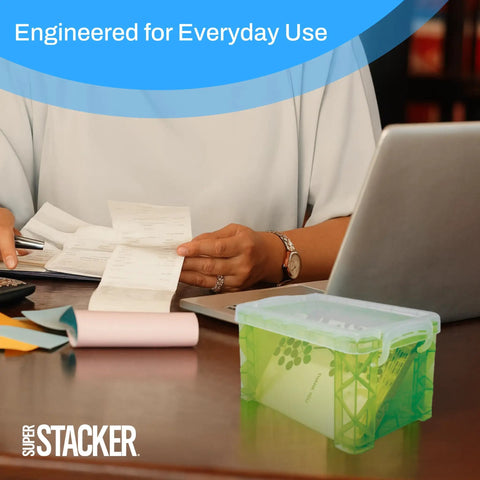 Person using a laptop with Durable 3x5 Index Card Box Organizer For Notes, Recipes, And Pics In Assorted Colors on desk