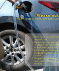 Heavy Duty Liquid Sucker Hand Pump With Large Bore Ball Valves And High Flow Hoses transferring fuel from a car tank.