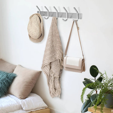 Sturdy Stainless Steel Wall Mount Coat Rack Set with Heavy Duty Hooks for Hats Towels Robes Jackets and Clothes Two Pack for Entryway or Bathroom Sleek Modern Hanger That Keeps Mess In Check installed in bedroom with hats and bag hung.