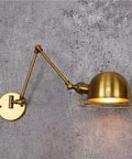 Dope Industrial Telescopic Swing Arm Wall Lamp For Living Room And Loft Vintage Golden Wrought Iron Sconce Adjustable Long Arm E26 E27 Base Creative Decorative Light For Barn Garage Workshop with golden finish on concrete wall.