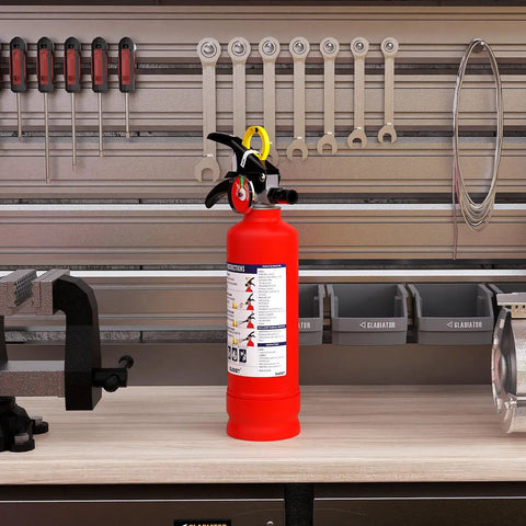 No Fuss ABC Home Fire Extinguisher 2.5 Lb Two Pack Top Shelf Rated Class A B C For Kitchen Garage on workshop table.