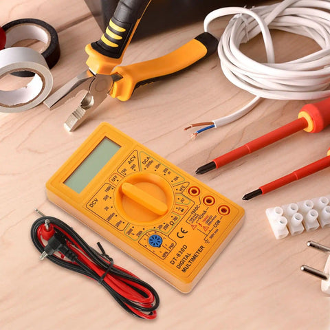 830D Digital Multimeter Tester with Buzzer 1999 Counts on wooden table with tools for electronics and automotive use.