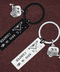 Two Pack Camping Keychains For Couples Outdoor Lovers Gift on textured background, silver-tone with camper and tent charms.