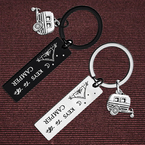 Two Pack Camping Keychains For Couples Outdoor Lovers Gift on textured background, silver-tone with camper and tent charms.