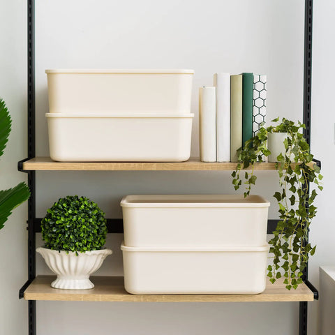 Two off-white 15 Quart Plastic Storage Bins With Lids 4 Pack Stackable Organizer Bins For Kitchen Bathroom And Bedroom on a shelf