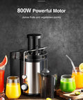 Powerful 800W centrifugal juicer with wide 3 inch feed chute, stainless steel body, black finish, BPA free, easy clean, shown with juices.
