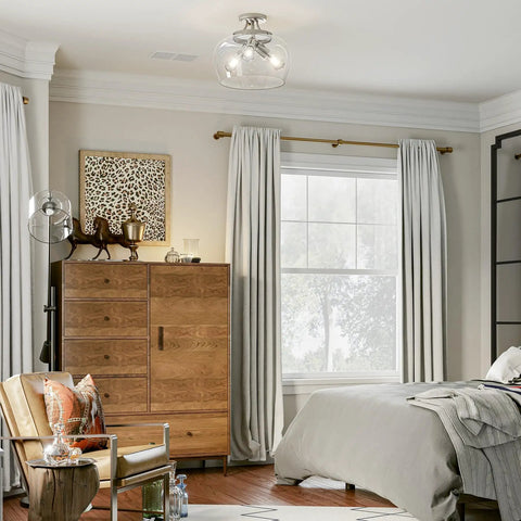 Modern Ceiling Light Fixture With Clear Glass Shade Three Light Brushed Nickel Semi Flush Mount illuminating a bedroom