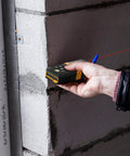 Laser Distance Measurer With 215 Ft Range, Diagonal Measuring Extension, And Mute Beep For Quiet Spaces, 100 Group Memory And Add Subtract Calculations, Ideal For Builders, Contractors, And DIYers measuring a cinder block wall