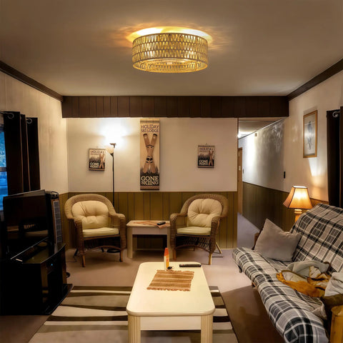 Retro BoHo Flush Mount Ceiling Fan With Open Caged Design And Integrated Warm Led Lighting illuminating a cozy living room.