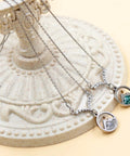 Faith Boost Mustard Seed Pendant Necklace For Women With V Shaped Stainless Steel Design And Cubic Zirconia Accents Displayed