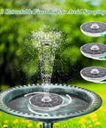 Six Point Five Watt Solar Fountain Pump With Color Changing LED Lights in bird bath showing water spray and anti-drift rods.