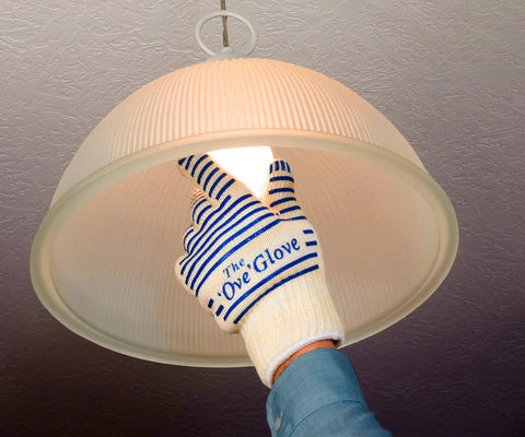 Heavy Duty Five Finger Oven Glove Pack Of 2 For Grillin And Barbecues used for changing a light bulb with superior heat protection.