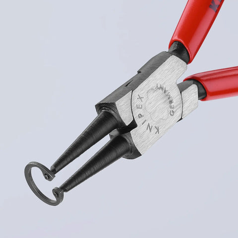 Close-up view of Internal And External Circlip Pliers Set With Straight And 90 Degree Tips, showing forged tips gripping a snap ring.