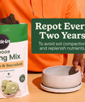 Top Shelf Indoor Potting Mix For Cactus And Succulents Featuring Sweet Roots Development With Rapid Drainage Sand Perlite And Peat Moss Formula Plus Loaded Plant Food For Ace Houseplants In 8 Quart Packs being poured into a ceramic pot.