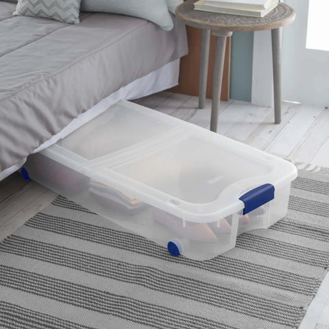 Two Pack 66 Quart Clear Underbed Storage Bins With Low Friction Wheels And Snap Tight Blue Latches under a bed, storing shoes.