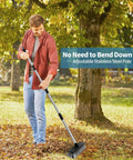 Heavy Duty Push Broom With Adjustable Stainless Handle And Tough Bristles Built For Sweeping Decks Garages And Driveways in use outdoors.