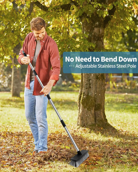 Heavy Duty Push Broom With Adjustable Stainless Handle And Tough Bristles Built For Sweeping Decks Garages And Driveways in use outdoors.
