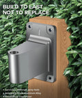 All-metal wall mount bracket for Retractable Garden Hose Reel With 5/8 Inch By 100 Foot Hose shown against greenery background.