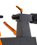WEN mini benchtop wood lathe with orange levers, black dial knob, and speckled gray base