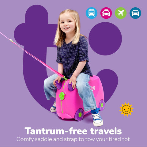 Child enjoying kids ride-on luggage, pink suitcase with wheels