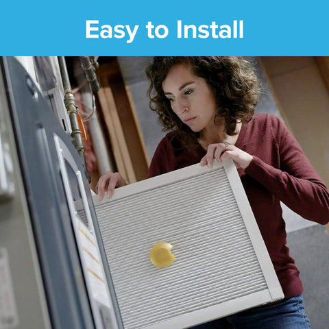 Person installing Smart Air Filter 16x25x1 With Bluetooth Sensor For Real Time Filter Life And Performance Tracking MPR 1900 MERV 13
