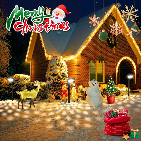 Snowy house decorated with lights and Christmas decorations, including a reindeer, snowman, and gifts, with "Merry Christmas" text.
