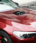 Premium Gloss Black ABS Plastic Hood Scoop Trim Built For Tesla Cybertruck installed on a red vehicle hood, showcasing sleek design.