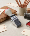 No Sweat 4 Digit Rubber Number Stamp With Adjustable Rotating Tapes, gray rubber numbers on metal roller, perfect for inventory tagging.