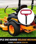 Magnetic Hitch Pin For Trailers And Mowers One Half Inch Heavy Duty Gate Pin With Strong Magnet For Lawn Tractors ATVs And Cargo Towing Simple One Handed Hook On Off Red on a lawn mower.