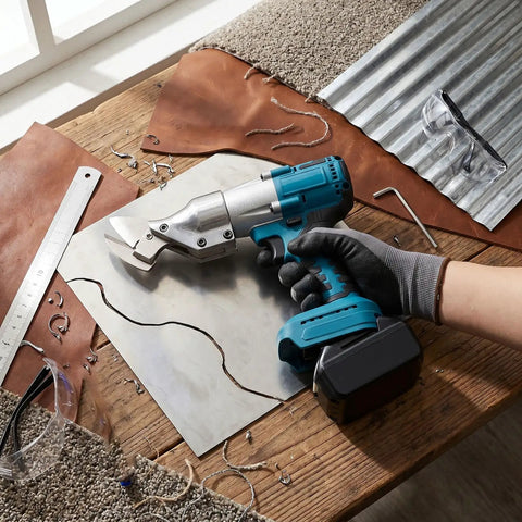 Depisuta Cordless Metal Shears Brushless Electric Scissors cutting 14Ga steel on wooden surface with leather and tools.