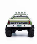 Badass 1/18 Scale RC Crawler With Slick Shifting Two Speed Transmission And Bulletproof Metal Gears Nasty Terrain Rock Climbing Rig Trail Smashin Setup Drop In Ready Convoy Medium Olive Green rear view with logo and lights.