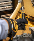 Using the Bolt Biter 2 Piece Impact Extraction Screwdriver Set for stubborn bolts and fasteners in an automotive workspace.