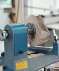 No Nonsense Heavy Duty 4 Inch Steel Wood Lathe Faceplate With 1x8TPI Spindle holding a rough wooden blank on a lathe.
