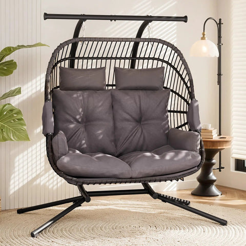 Double Egg Chair With Removable Adjustable Canopy For Outdoor Hangout Patio Balcony And Garden Oversized Hanging Hammock Chair With Cushioned Basket For Chilling In Sun Or Shade, featuring grey cushioned seating indoors.
