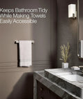 Honesty 12-Inch Towel Bar In Vibrant Brushed Nickel Finish, mounted on bathroom wall with towels, modern accessory in stainless steel