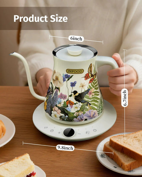 Person holding 0.8L Gooseneck Electric Kettle with Precise Temperature Control for Pour Over Coffee and Tea, floral design, on a table.