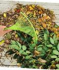 Dope Garden Rake Hand Tool With Tough Tines For Loosening Soil And Cultivating Flowers And Plants Lightweight Gardening Supply For Lawn Maintenance Ideal For Weeding Dethatching And Easy Garden Care, green steel leaf rake in use