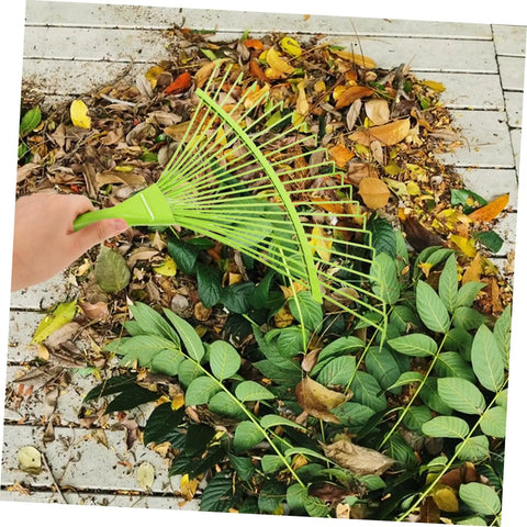 Dope Garden Rake Hand Tool With Tough Tines For Loosening Soil And Cultivating Flowers And Plants Lightweight Gardening Supply For Lawn Maintenance Ideal For Weeding Dethatching And Easy Garden Care, green steel leaf rake in use