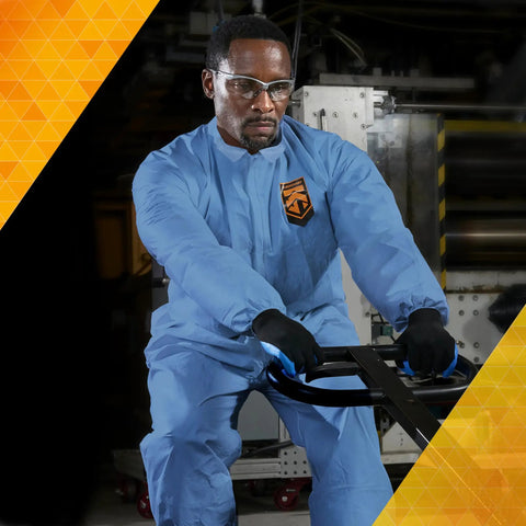 Person wearing Breathable Particle Protection Coveralls With Reflex Design, Zip Front, Elastic Back, Blue Denim, Size 2XL in work setting.