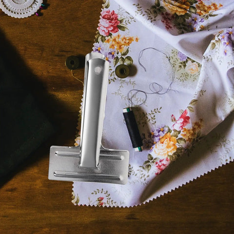 Heavy Duty Metal Sewing Bed Cloth Clamps For Hemming And Fabric Quilting Workholding Tools on floral fabric with thread.
