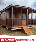 Heavy Duty 5000 Pound Screw Jacks For Floor Leveling Adjustable Foundation Supports shown under a wooden house.