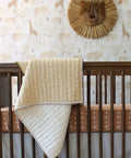 Traditional Paste The Wall Safari Nursery Wallpaper With Watercolor Lions Elephants And Giraffes Print in a cozy baby room