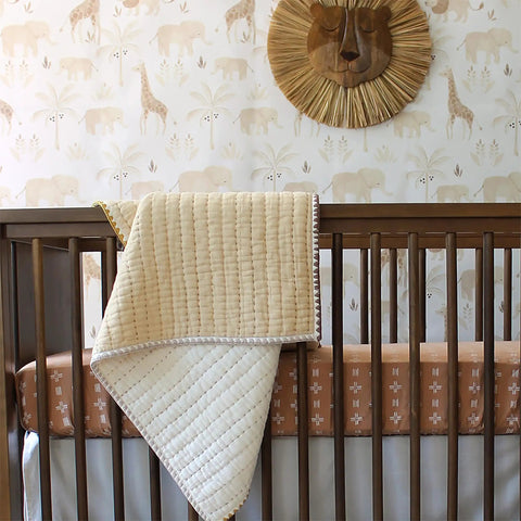 Traditional Paste The Wall Safari Nursery Wallpaper With Watercolor Lions Elephants And Giraffes Print in a cozy baby room