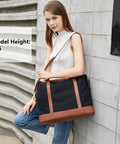 Woman holding Canvas Travel Tote Bag For Women With Zipper, Weekender Duffel And Carry On Tote, black and brown color