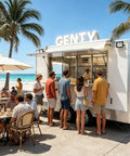 Premium White Food Truck 13ft Heavy Duty Fiberglass Mobile Beverage Cart With Cozy Seating serving drinks to customers by the beach.