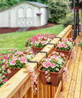 Straight Up Level Up Your Porch With These Four Pack Railing Planter Boxes Featuring Double Sided Adjustable Brackets For No Sweat Setup And Growing Fresh Herbs Or Vibrant Blooms Anytime You Want To Relax - Planters with pink flowers on a wooden railing.