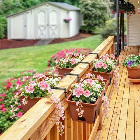 Straight Up Level Up Your Porch With These Four Pack Railing Planter Boxes Featuring Double Sided Adjustable Brackets For No Sweat Setup And Growing Fresh Herbs Or Vibrant Blooms Anytime You Want To Relax - Planters with pink flowers on a wooden railing.