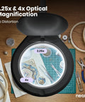 Pro Grade LED Magnifying Lamp With Clamp showing 2.25x and 4x magnification over crafting supplies