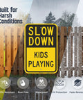 Heavy Duty Slow Down Kids Playing Neighborhood Warning Sign Crafted From Tough 63 Mil Aluminum in harsh weather conditions.